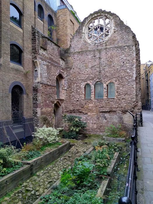 The ruins of Winchester Palace showing the Rose Window and the three doors from the screens passage that would have led to the palace's buttery, pantry and kitchen. 