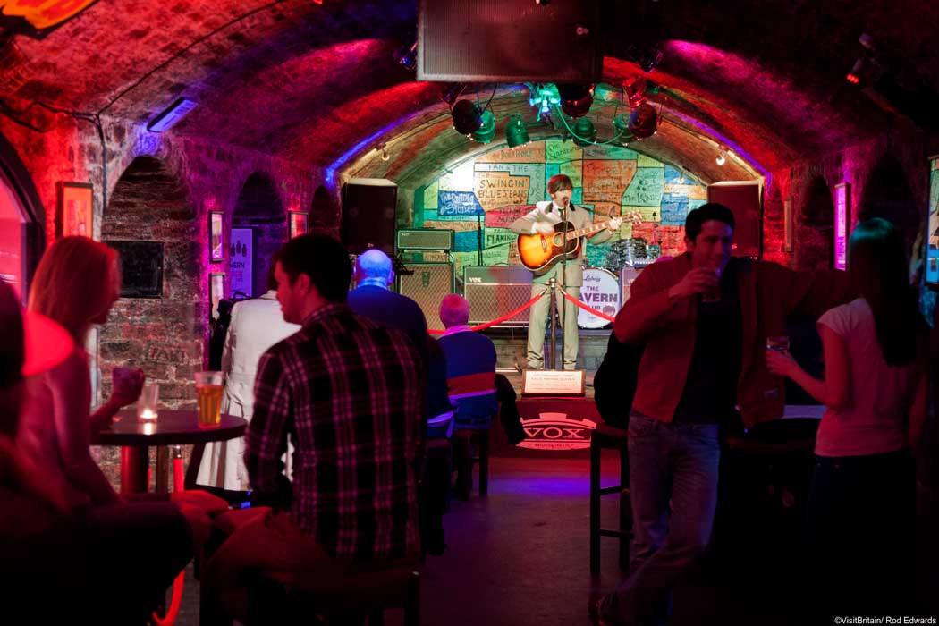 In the early 1960s, The Beatles played almost 300 gigs at the Cavern Club on Matthew Street in Liverpool. You can recreate the experience by visiting the Cavern Club to see their in-house Beatles tribute band. (Photo © VisitBritain/Rod Edwards). 