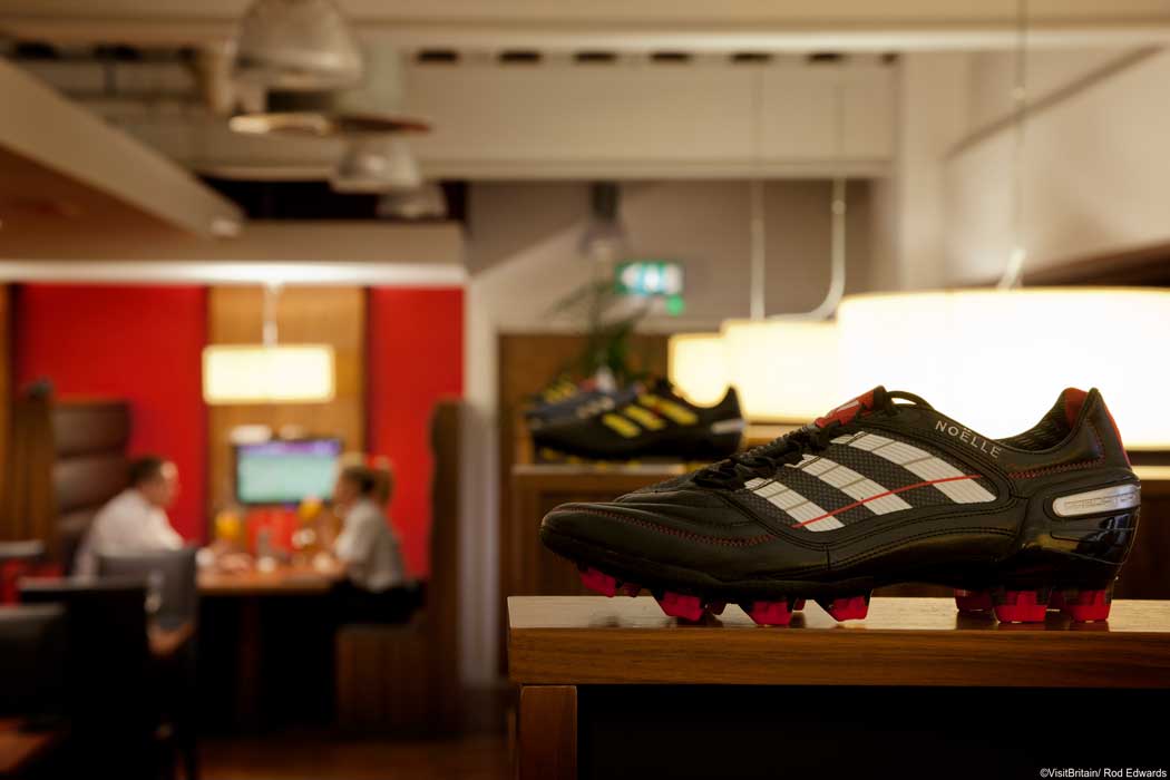 After the stadium tour, pop into the Boot Room sports cafe for something to eat and drink. There is more LFC-themed sports memorabilia on display inside the cafe. (Photo © VisitBritain/Rod Edwards). 