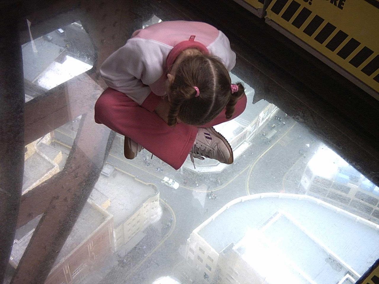 Sitting on the glass floor on the Blackpool Tower Eye observation deck at the top on the Blackpool Tower (Photo: Neil Gray)