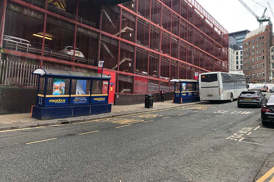 In contrast to Birmingham’s fancy National Express coach terminal, the Megabus coach stop is just a basic bus stop with limited places to sit. (Photo © 2024 Rover Media)