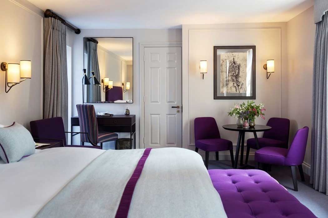 The 35 guest rooms at the Old Parsonage Hotel have comfortable beds and work desks