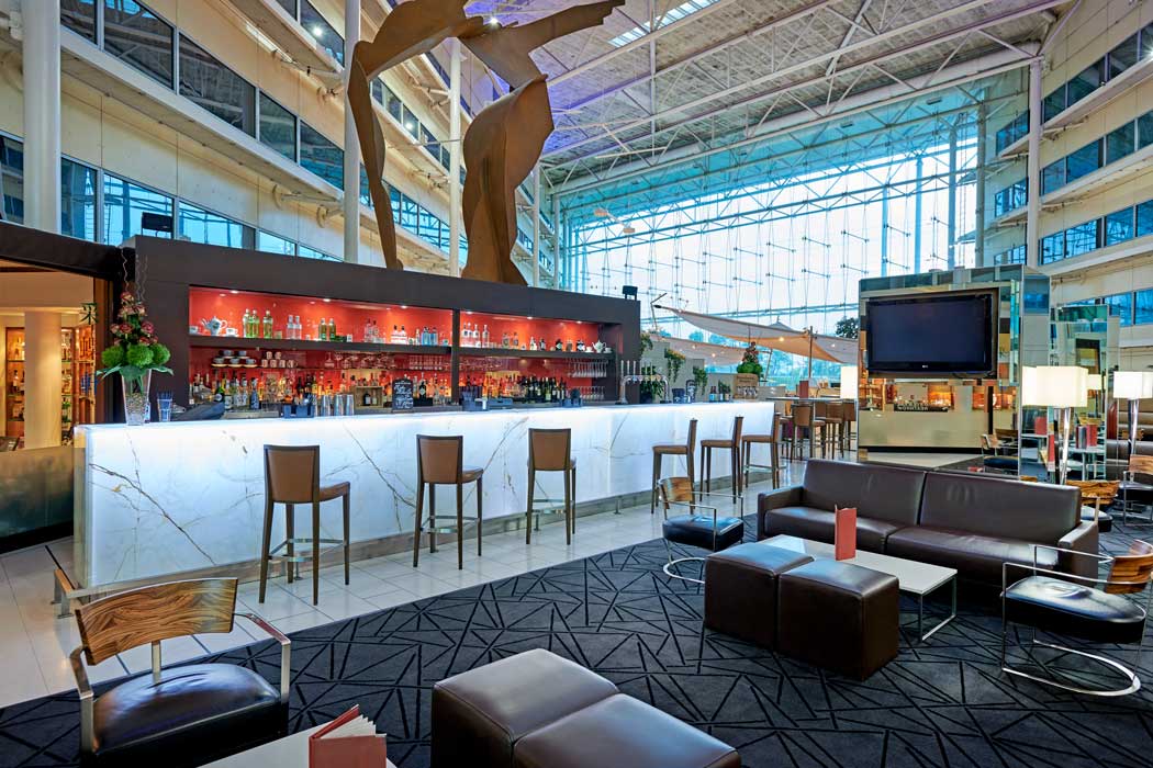 The atrium area inside the Hilton London Heathrow Airport hotel is a large space that feels a lot like the inside of an airport terminal. (Photo © 2019 Hilton)