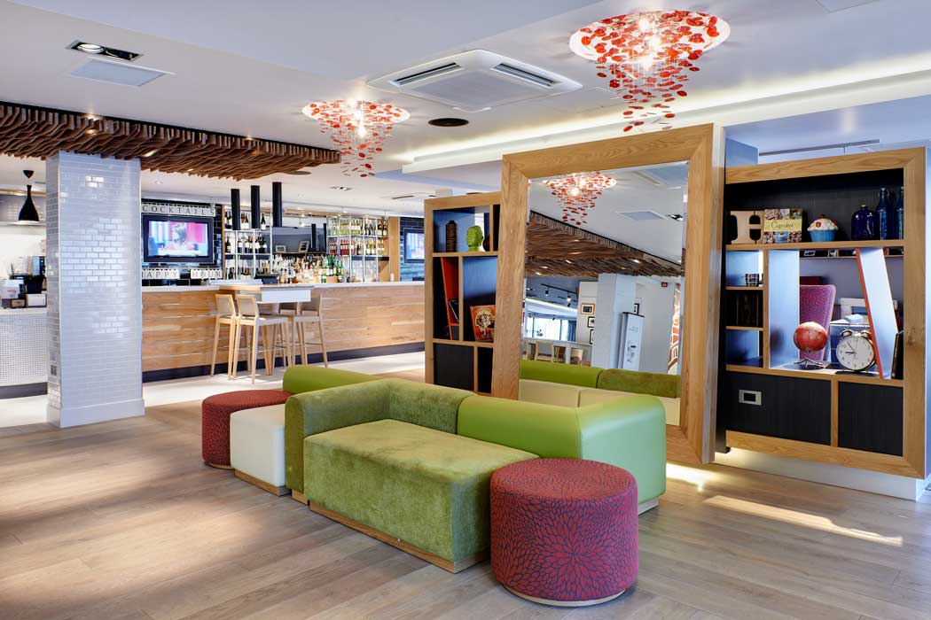 The hotel’s lobby area is a nice space to relax with a drink or get some work done. (Photo: IHG)