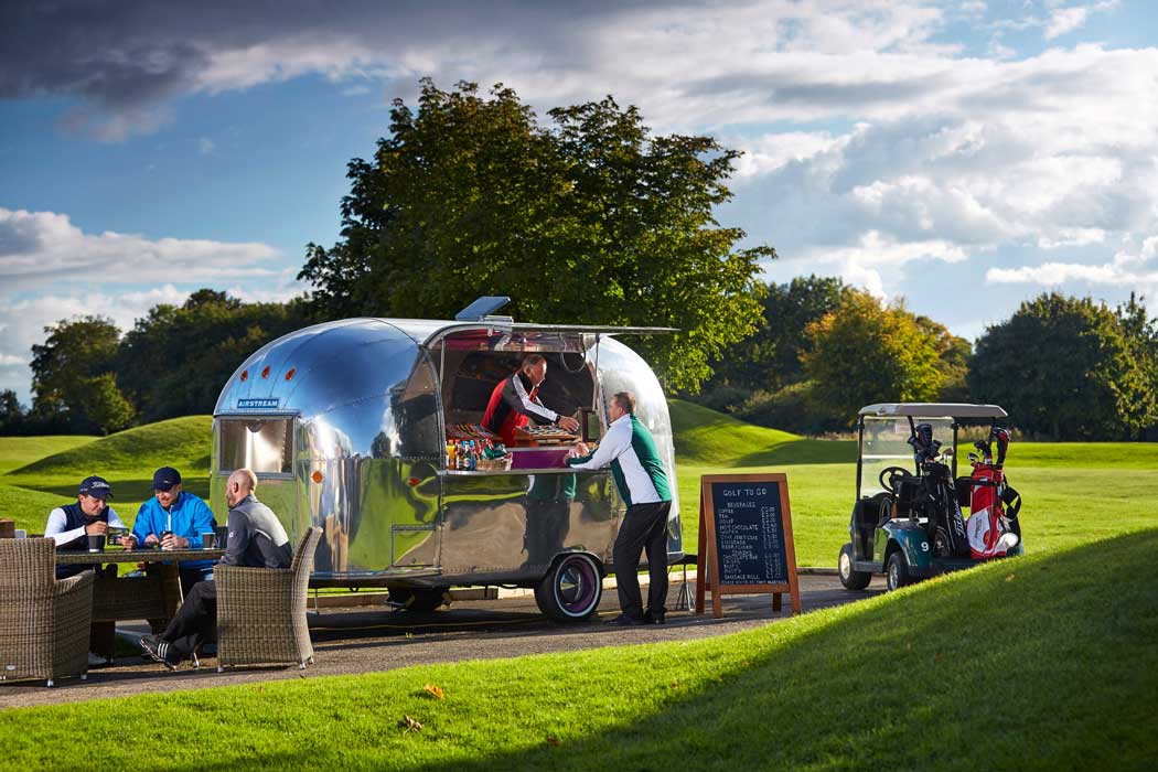 The 18-hole golf course at the Manor House Hotel has its own choice of places to eat and drink including an Airstream caravan serving drinks at the 10th hole. (Photo © Dave Green/Exclusive Hotels)