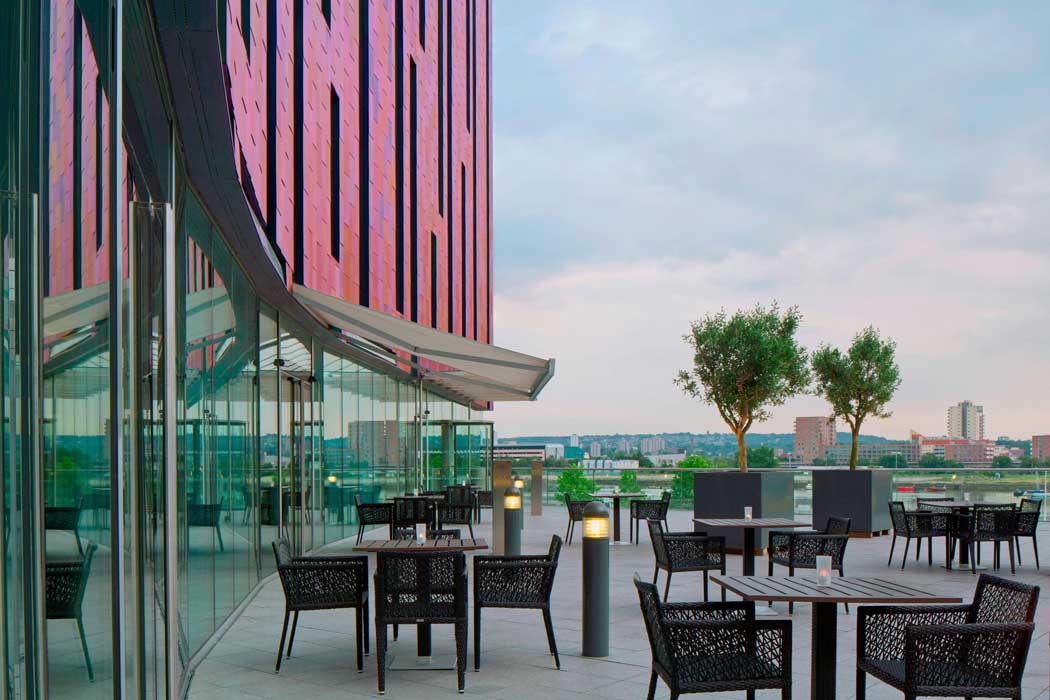 The hotel’s outdoor terrace is a nice spot for a drink on a sunny day. (Photo: Marriott)