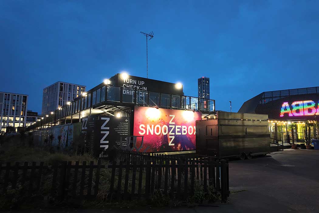 Snoozebox is a unique accommodation option comprised of hotel rooms built inside shipping containers. It is located near Abba Arena and is just one stop on the DLR from Stratford. (Photo © 2024 Rover Media Pty Ltd)