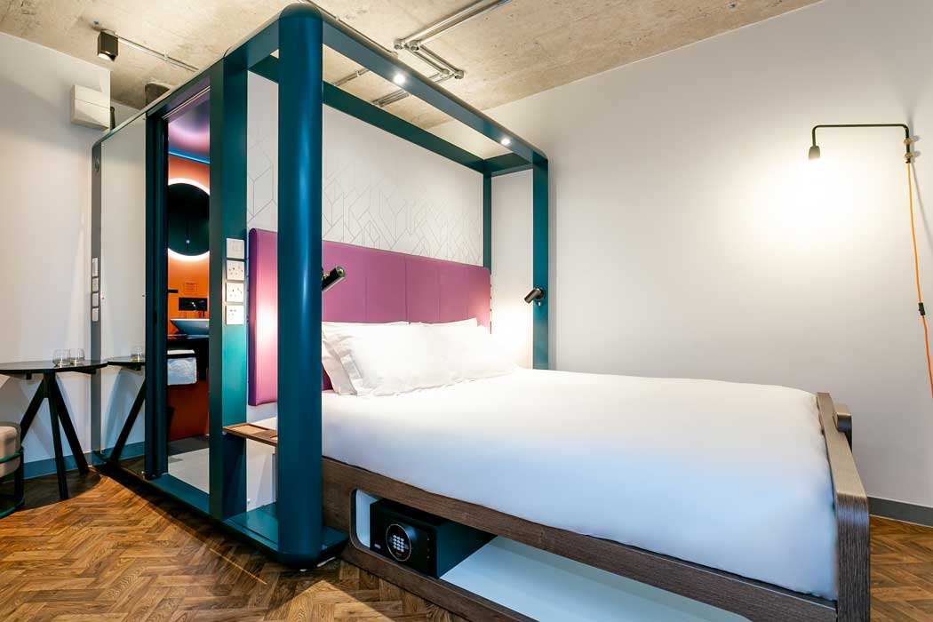 The hotel is set in a converted office building and most rooms have the en suite bathroom built behind the bed. (Photo: YOTEL)