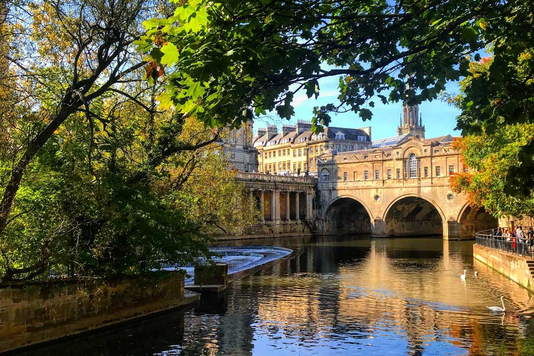 Pulteney Bridge in Bath as seen from the footpath on the Bathwick side of the River Avon