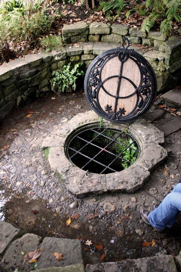 Some people believe that the Chalice Well in Glastonbury is the site of the Holy Grail. The well cover was designed by architect and archaeologist Frederick Bligh Bond. (Photo: Kurt Thomas Hunt [CC BY-SA 2.0])