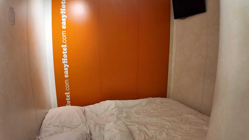 The tiny 6m² rooms at the easyHotel South Kensington are barely big enough to fit a double bed. (Photo © 2024 Rover Media Pty Ltd)