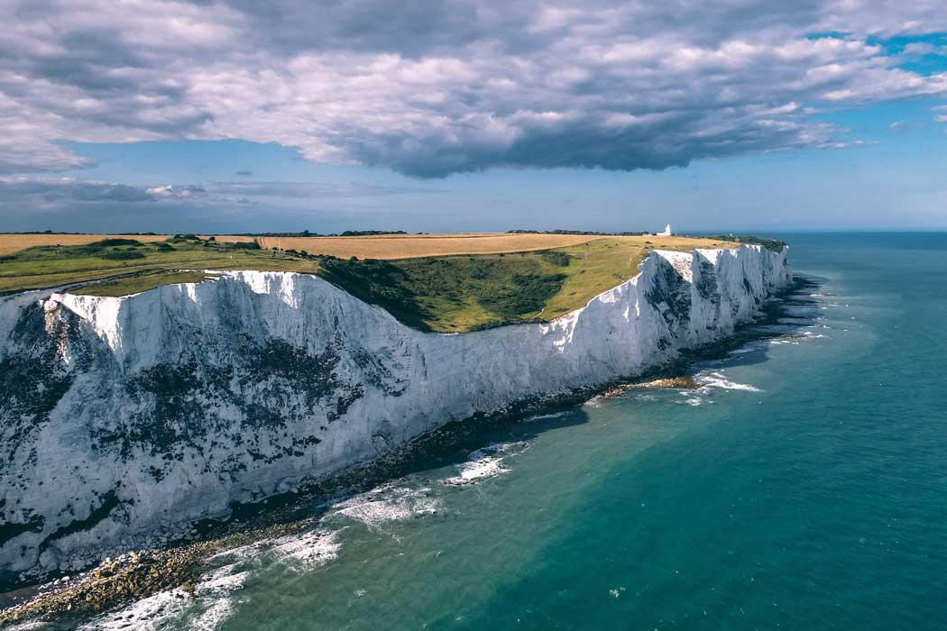 The White Cliffs of Dover is the first sight of England for many visitors arriving by ferry from France. (Photo by Eamonn Wang on Unsplash)