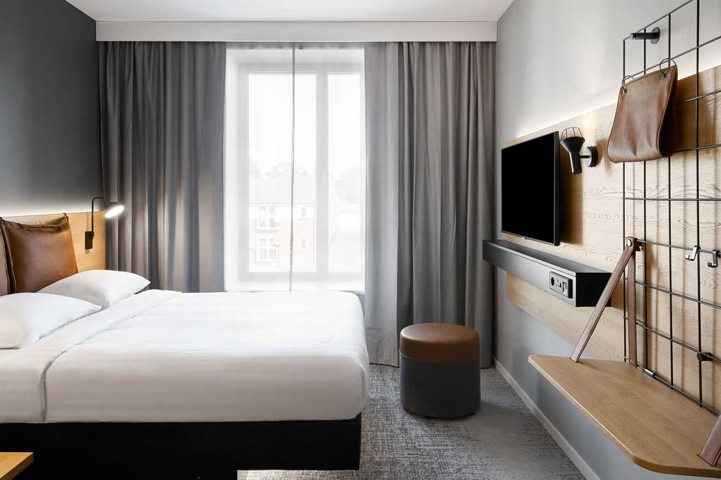 Rooms have a compact pull-down desk but it’s a much smaller workspace than you would find at most other hotels. (Photo: Marriott)